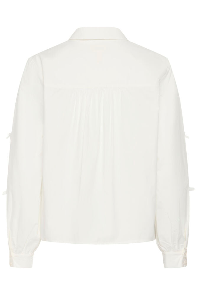 Cream blouse strikjes