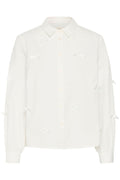 Cream blouse strikjes